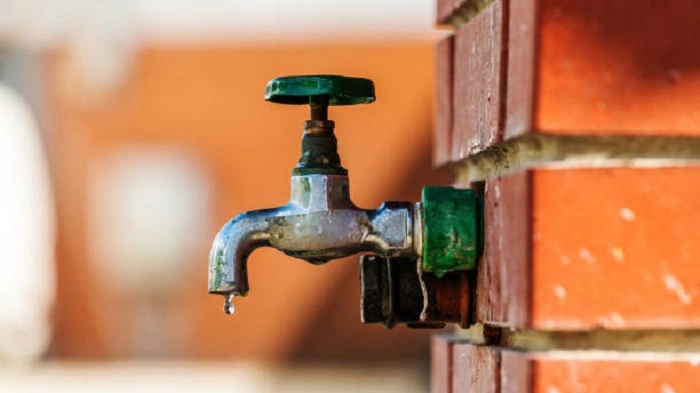 leaking faucet in a garden