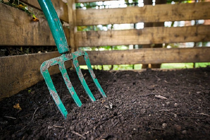 turning the compost pile