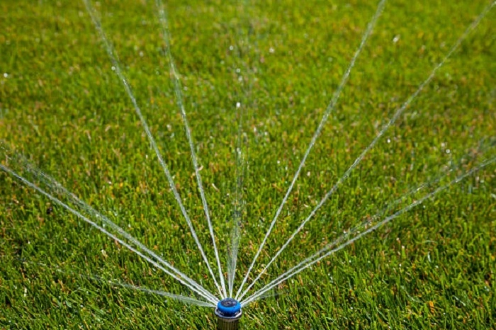 image of a water sprinkler running off a well
