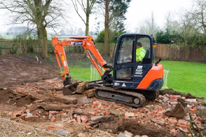 image of construction machinery in a lawn resulting in lawn depression