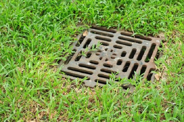 image of drainage hole in a lawn