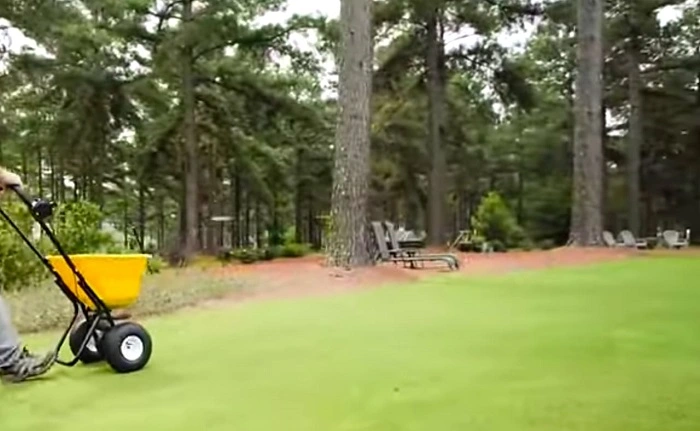image of applying pre emergent herbicide