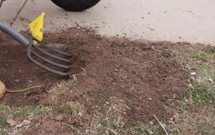 image of Roundup dead grass removal and soil digging with the help of shovel