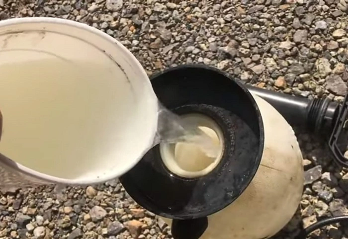 image of spray salt mixture to kill weeds