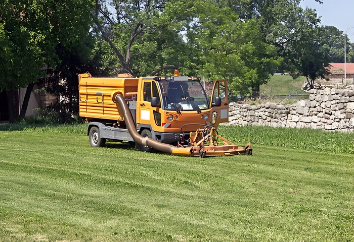 image of using heavy lawn mowers in lawn