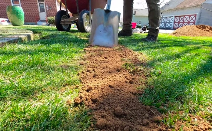 image of adding dirt on lawn grass